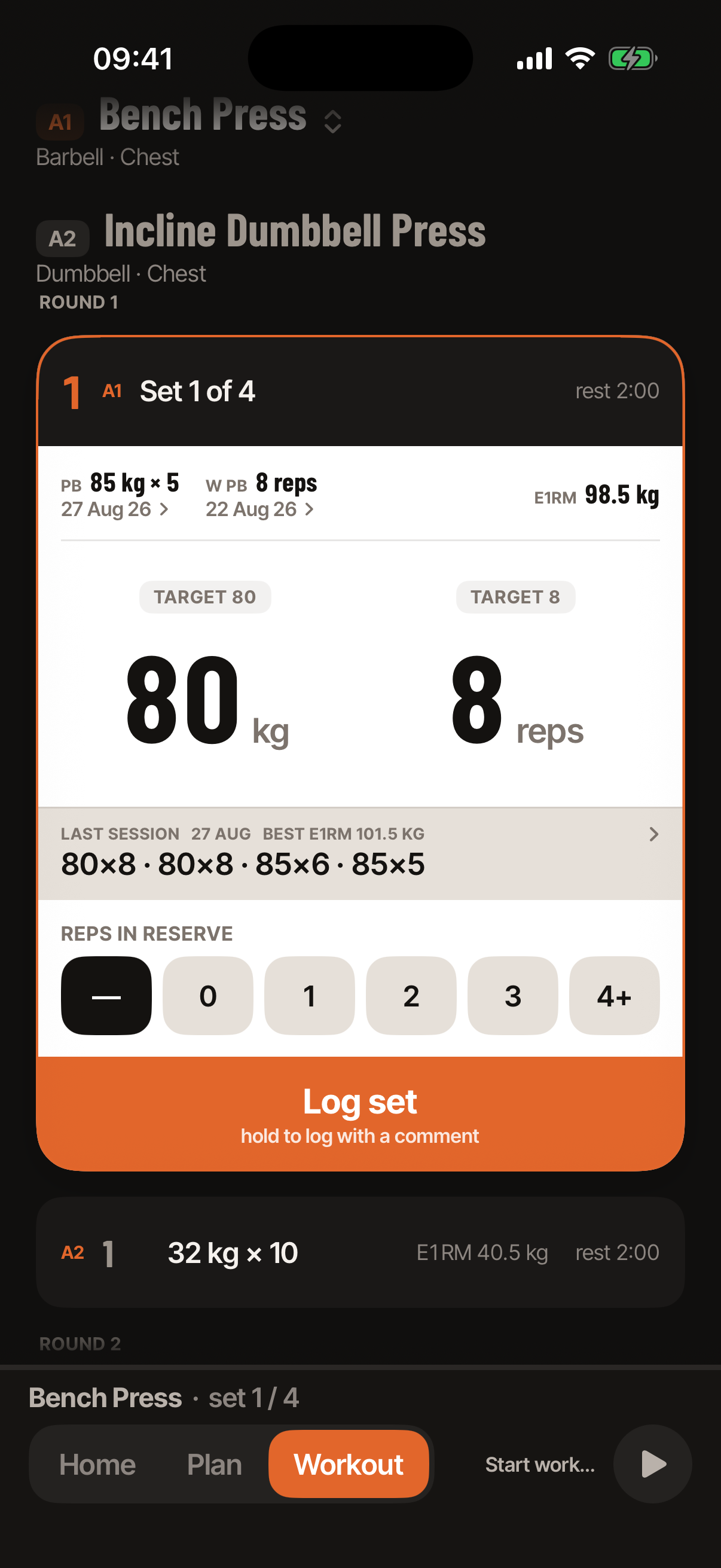 Workout mode during a bench press set: the personal-best header for the weight in the field, the last session's sets in a line, big numerals for weight and reps, reps-in-reserve chips and a Log set button.